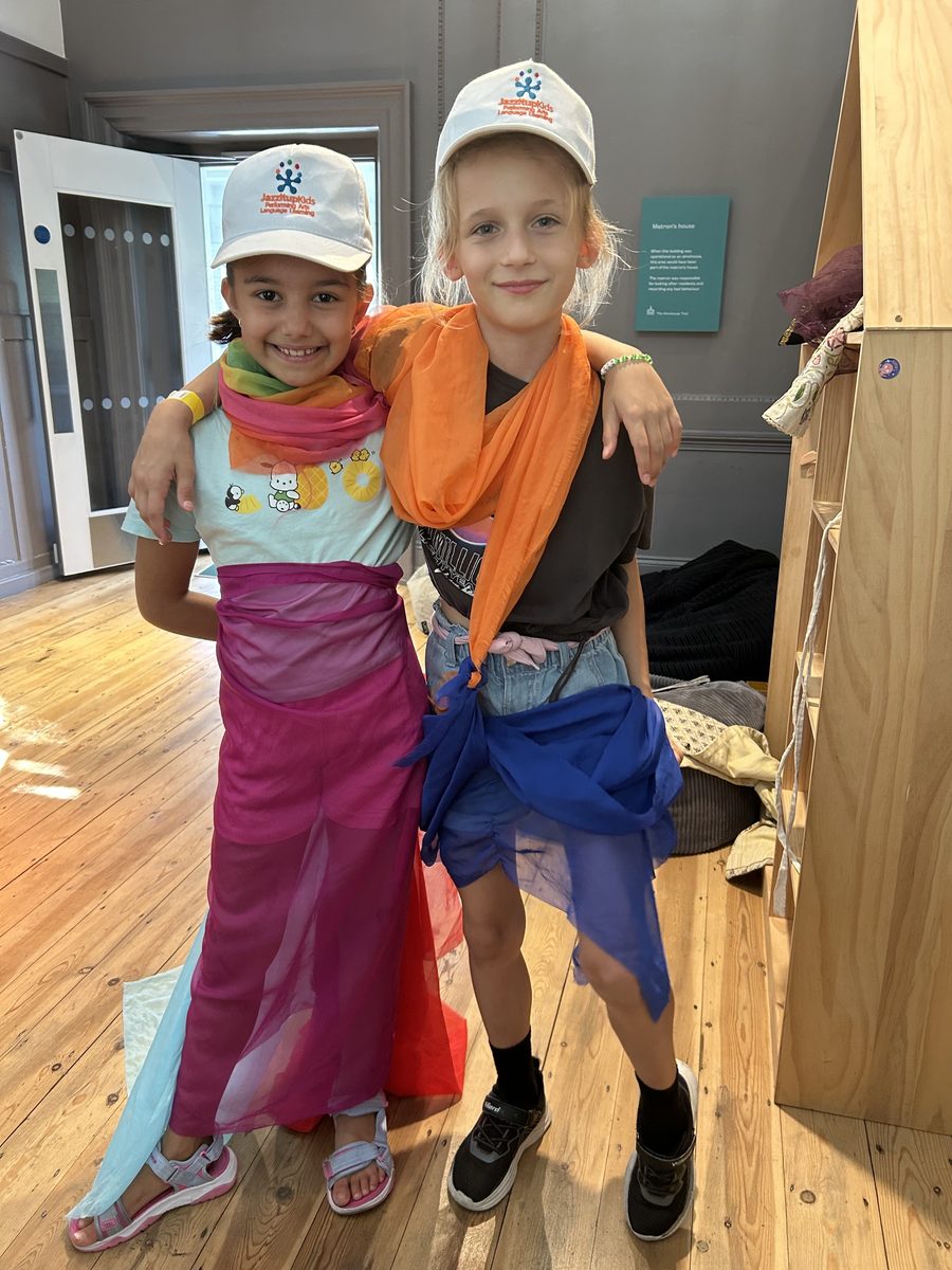 Children enjoying a costume activity at Jazzitup Kids London holiday camp
